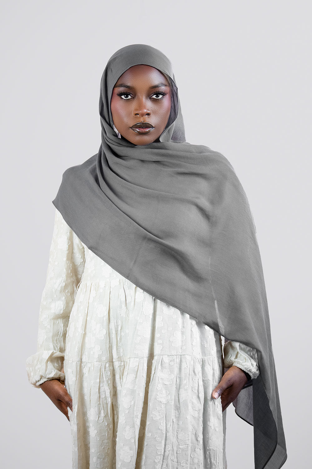 Woman wearing a gray  modal hijab
