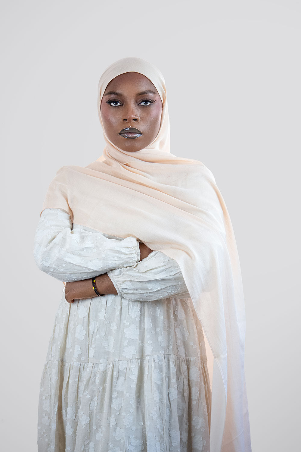 Woman wearing a beige hijab 